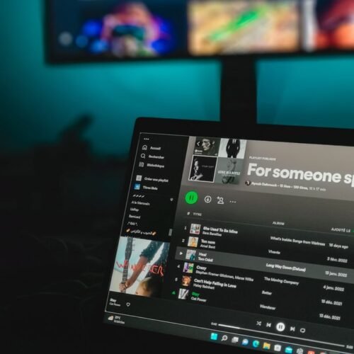 pexels-photo-17367706-17367706 Laptop displaying a music playlist on a streaming service screen.